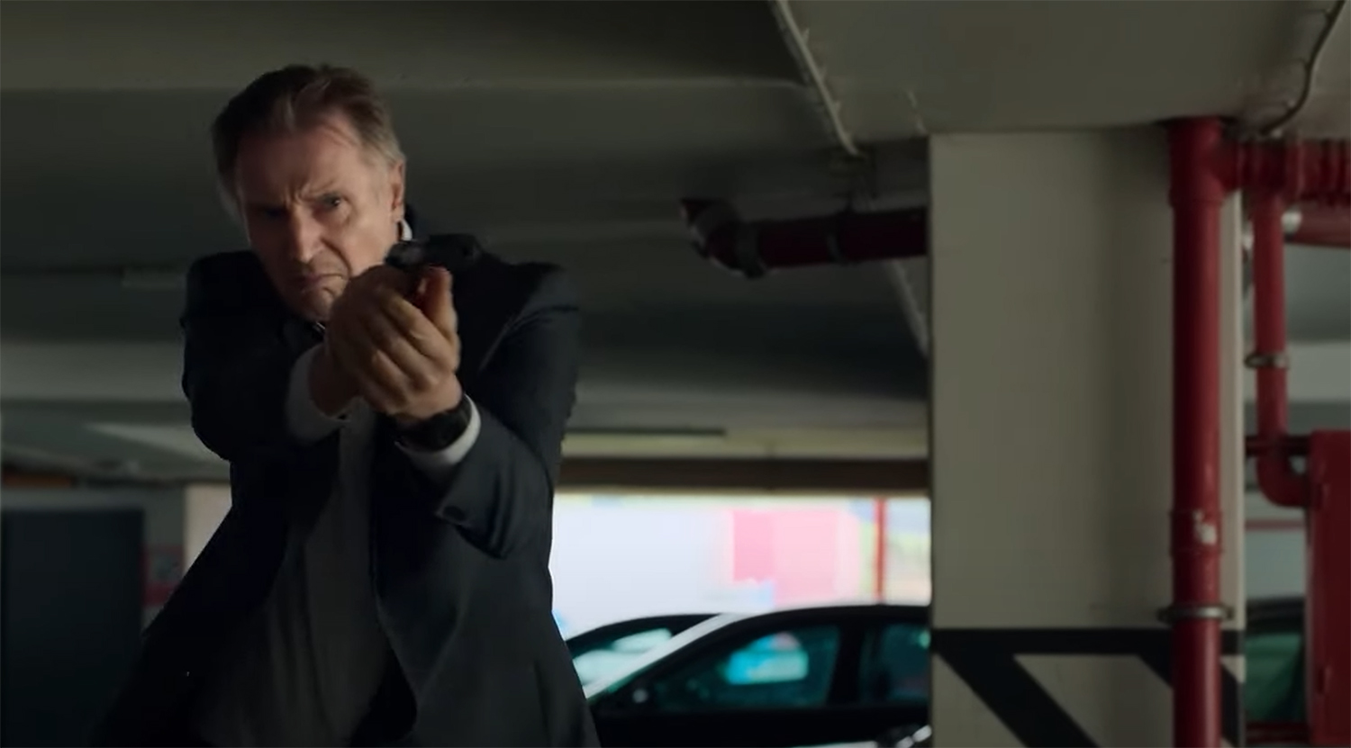 Liam Neeson firers his gun.