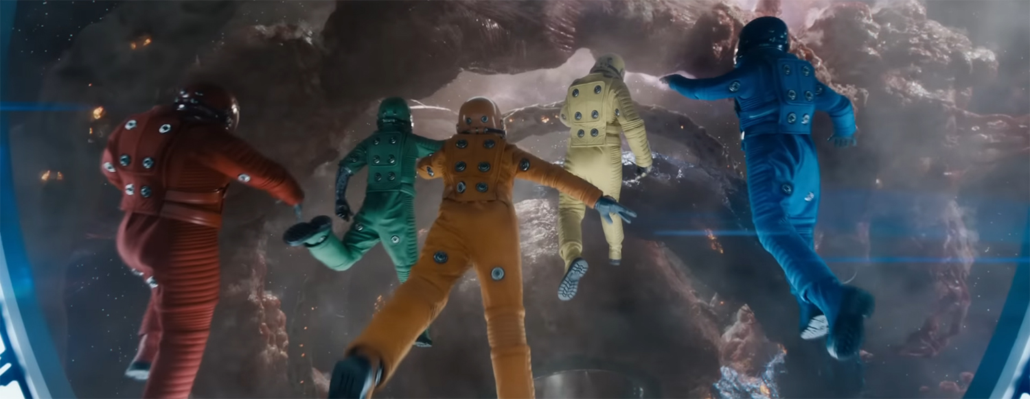 Bouncing around in multi-coloured space suits.