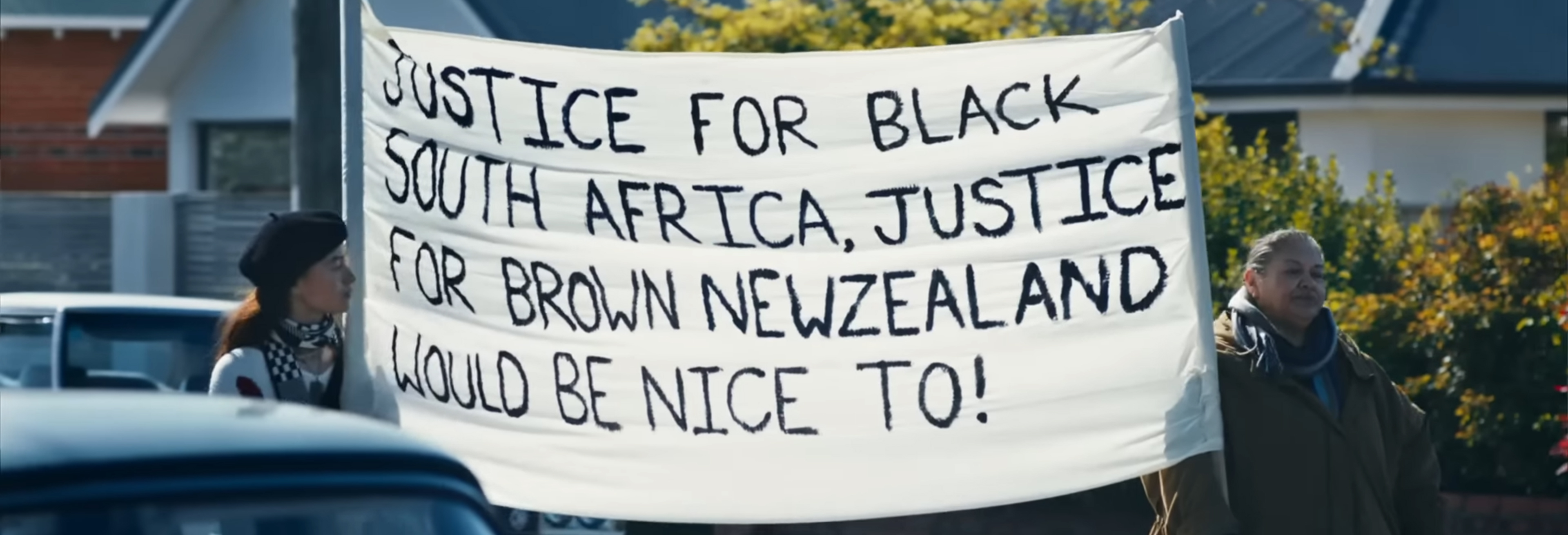 A sign that says "Justice for Black South Africa, Justice for Brown New Zealand would be nice to!"
